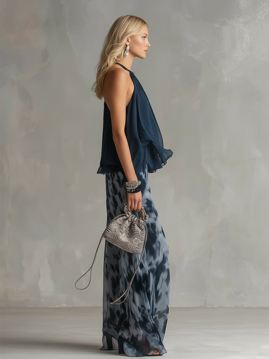 Ludovica - elegante en chiffón con una blusa de cuello alto y pantalones anchos estampados