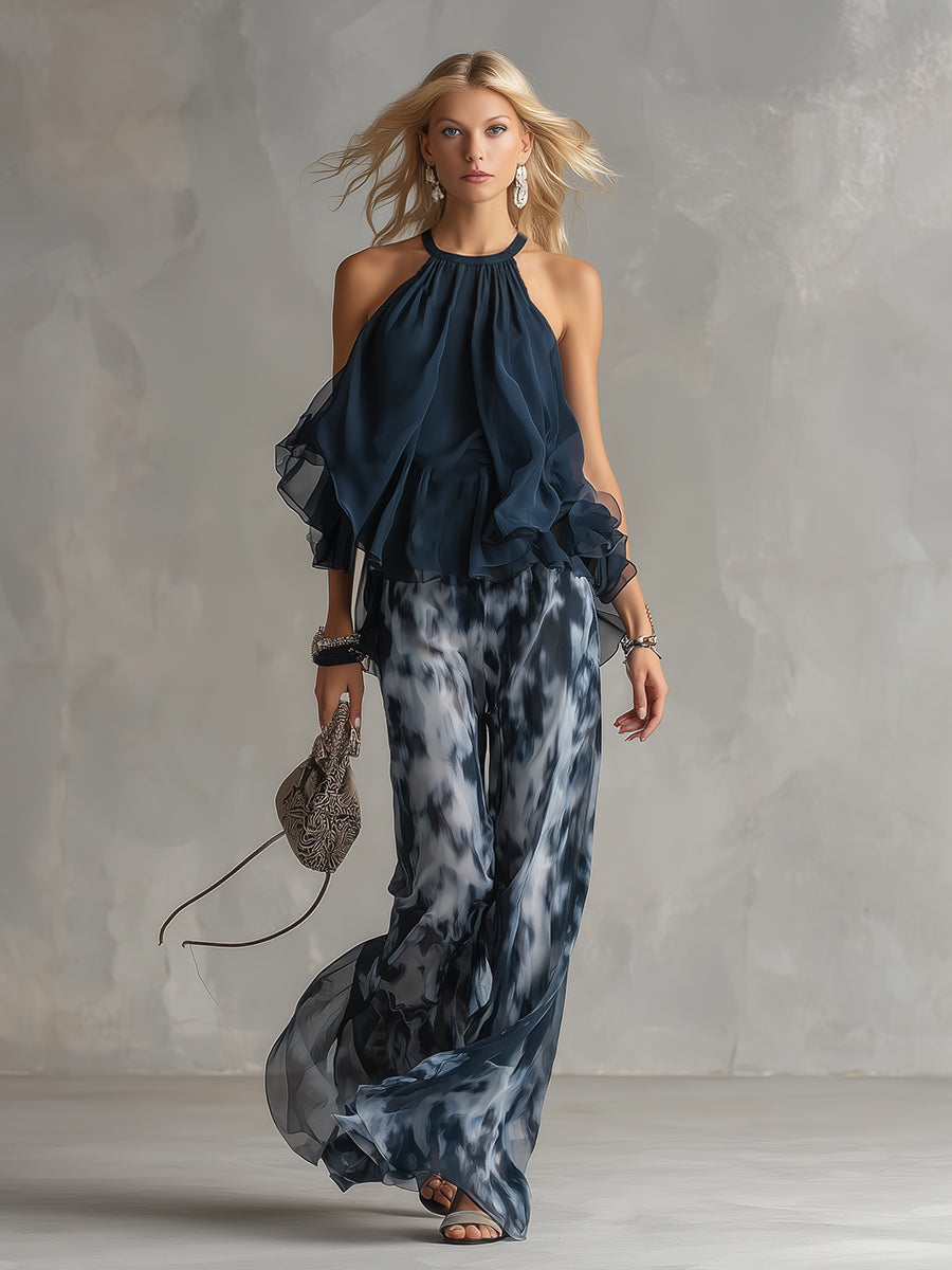 Ludovica - elegante en chiffón con una blusa de cuello alto y pantalones anchos estampados