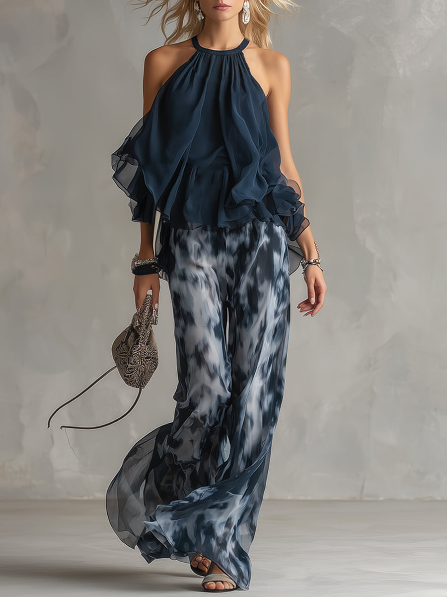 Ludovica - elegante en chiffón con una blusa de cuello alto y pantalones anchos estampados