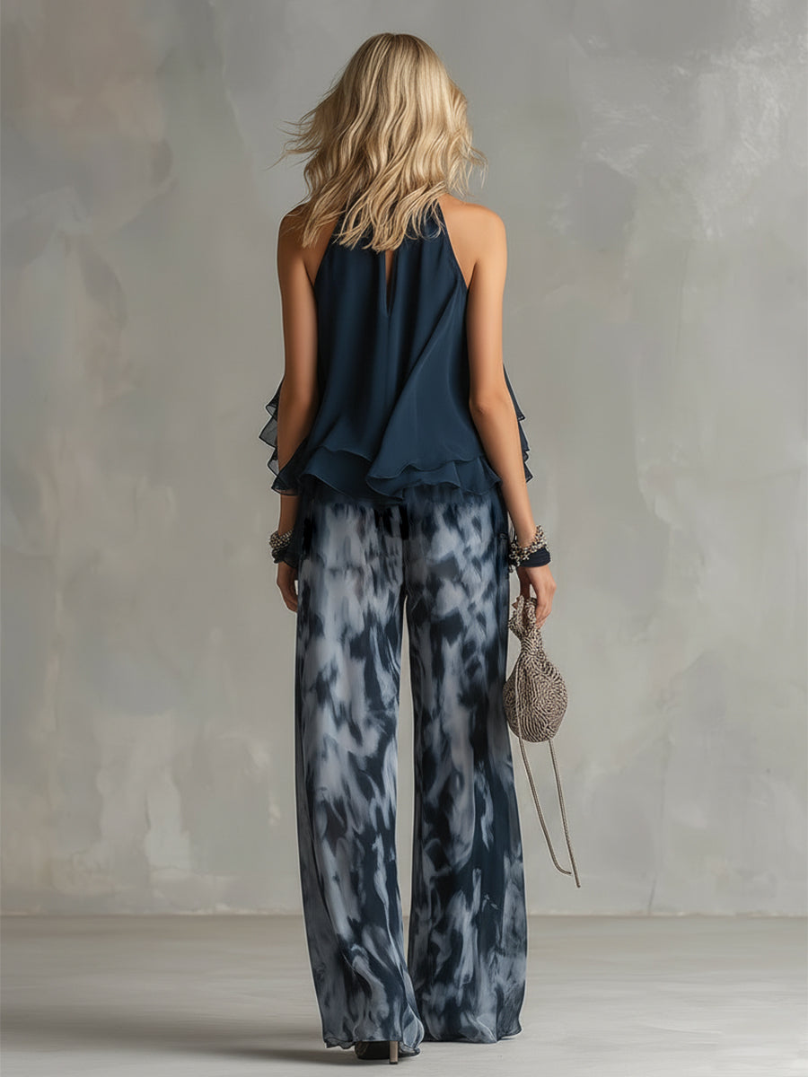 Ludovica - elegante en chiffón con una blusa de cuello alto y pantalones anchos estampados